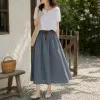 A grey lace-up dress for women, a high-waisted and cinched dress that accentuates the figure in summer details Picture